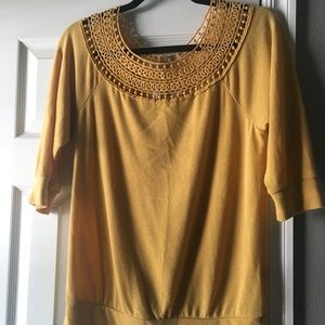 mustard yellow light sweater with cute detail